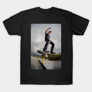 Skateboarder doing a board slide T-Shirt